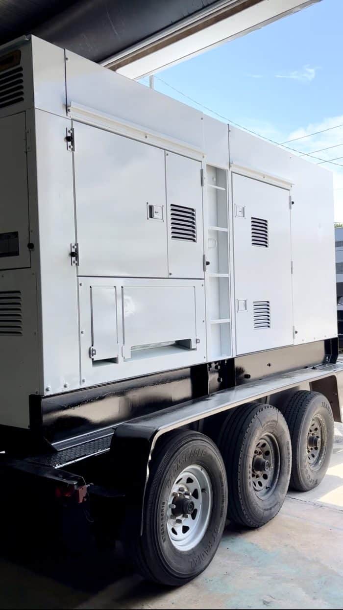 A Close Up View Of The Fresh Coat Of White Paint On The Commercial Generator That Was Refurbished.